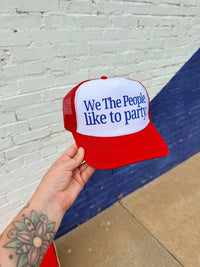 580 Trucker Hat + We the People Red