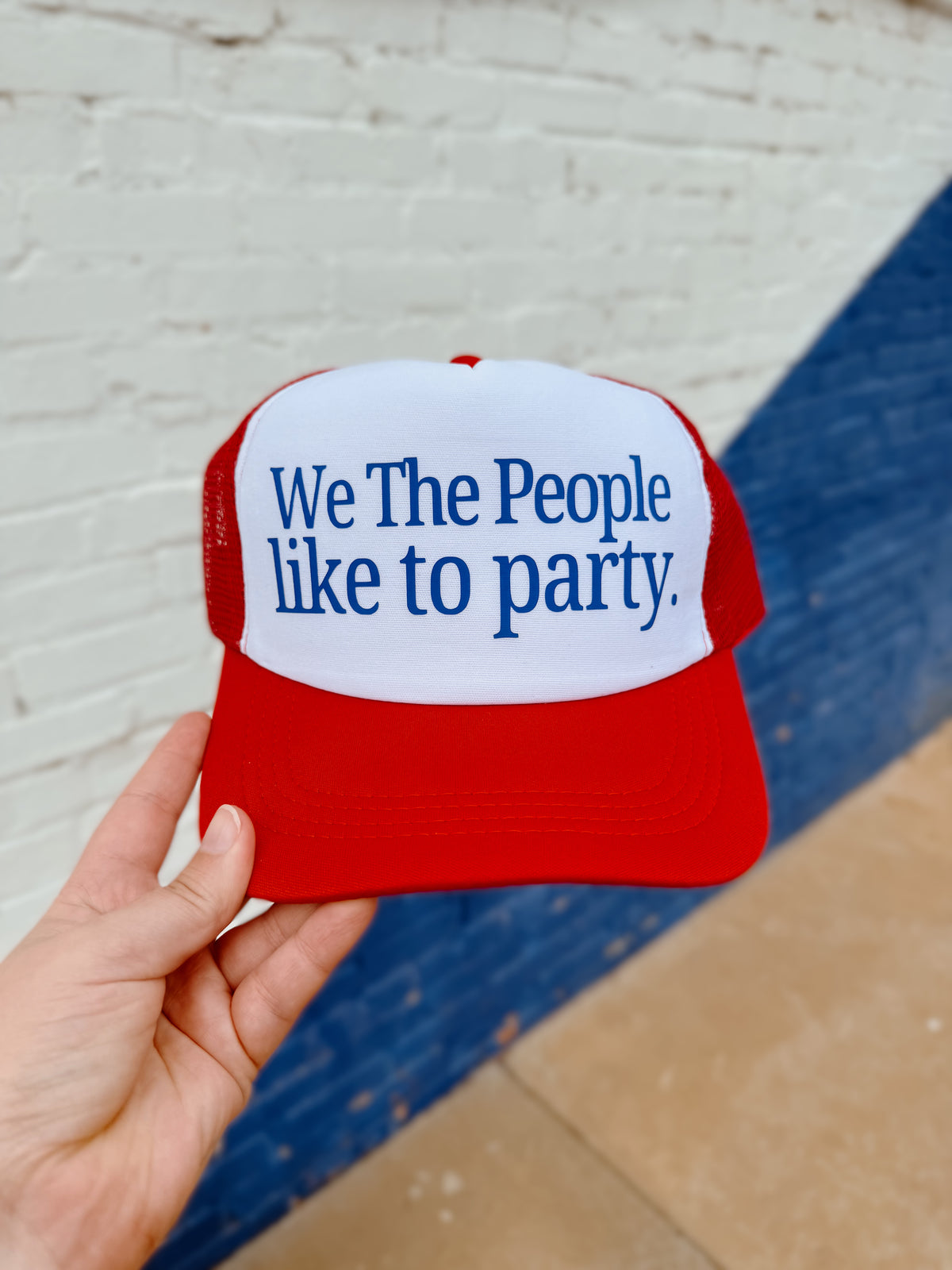 580 Trucker Hat + We the People Red