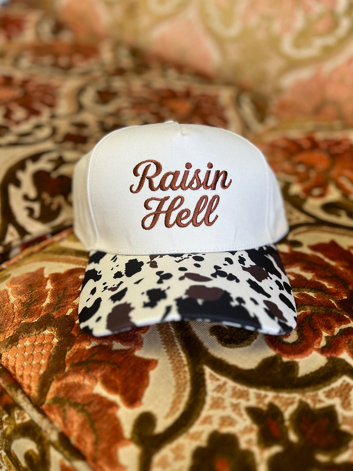 Raisin Hell Ball Cap + Cow Print